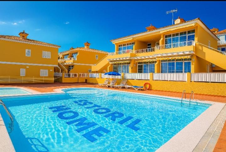 a large swimming pool in front of a house at Loma Estrella Ocean Suite Upper Arguineguín in Arguineguín