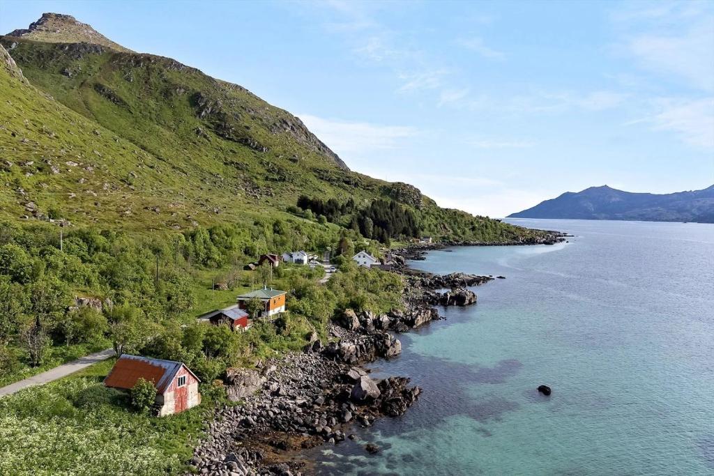 an aerial view of a small island in the water at Room with Midnight-sun and Norhern-light View in Vestvågøya