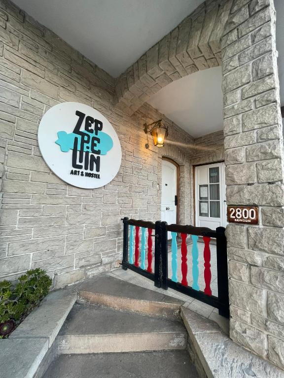 a front entrance to a house with a sign at Zeppelin Art-Hostel in Mar del Plata