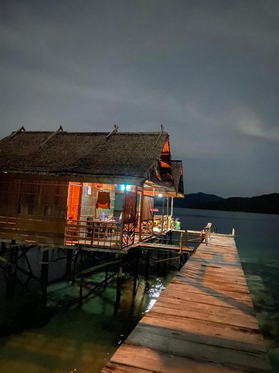 a house on a dock on the water at Mantorom homestay in Yennanas Besir