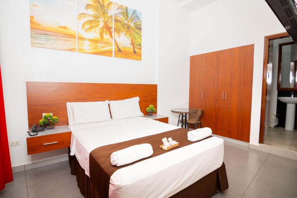 Ένα ή περισσότερα κρεβάτια σε δωμάτιο στο HOTEL SAN JUAN, Tarapoto