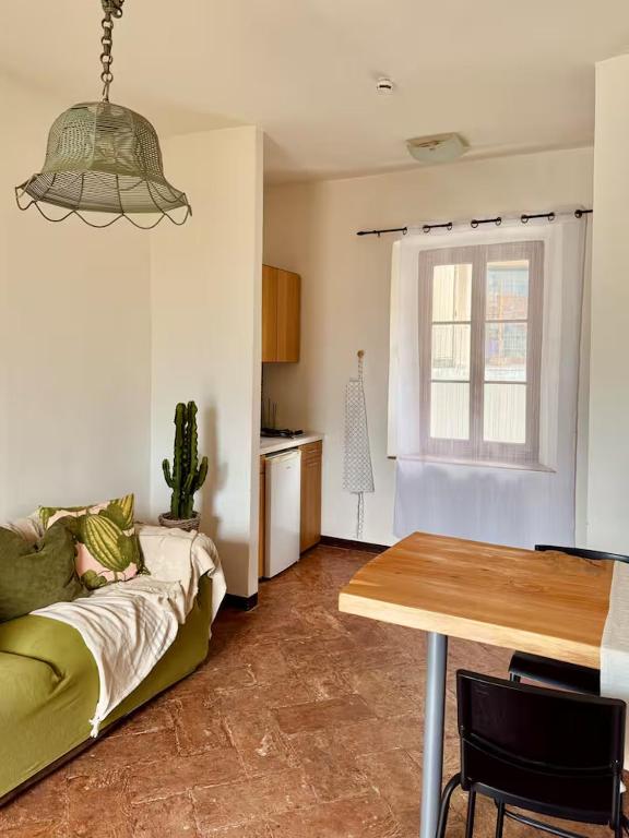 a living room with a couch and a table at Residenza Renata in Onno