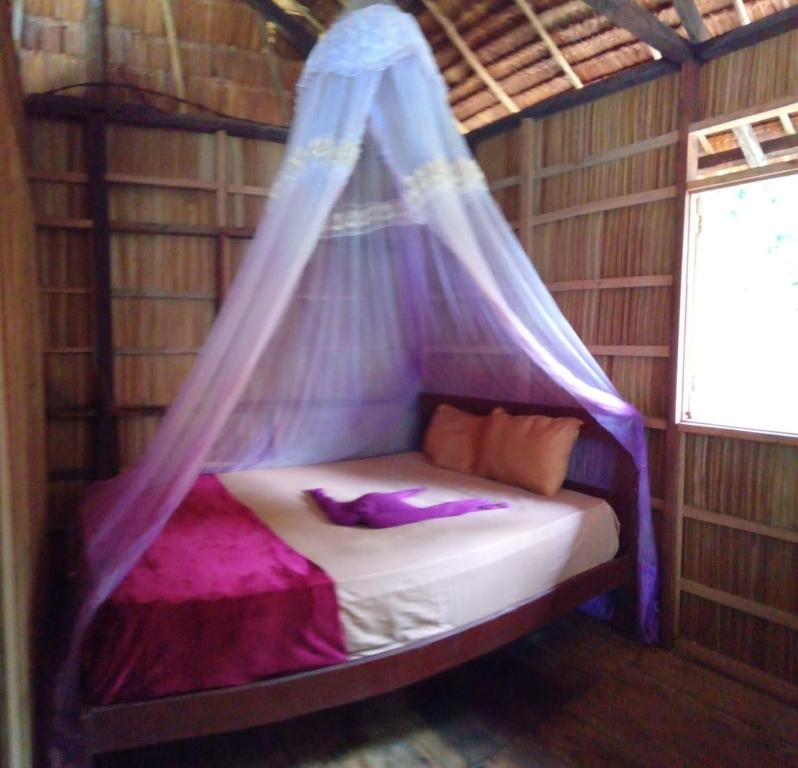 Ένα ή περισσότερα κρεβάτια σε δωμάτιο στο " Wobbegong Raja Ampat "