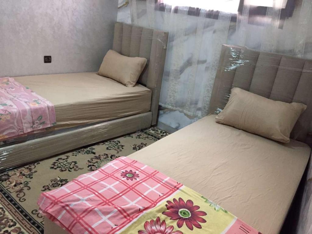 Кровать или кровати в номере Studio meublé AGADIR