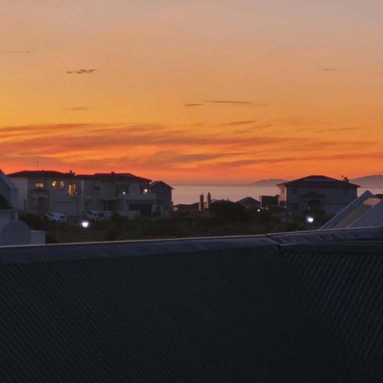 a sunset from the roof of my house at Codrock Cottage in Langebaan