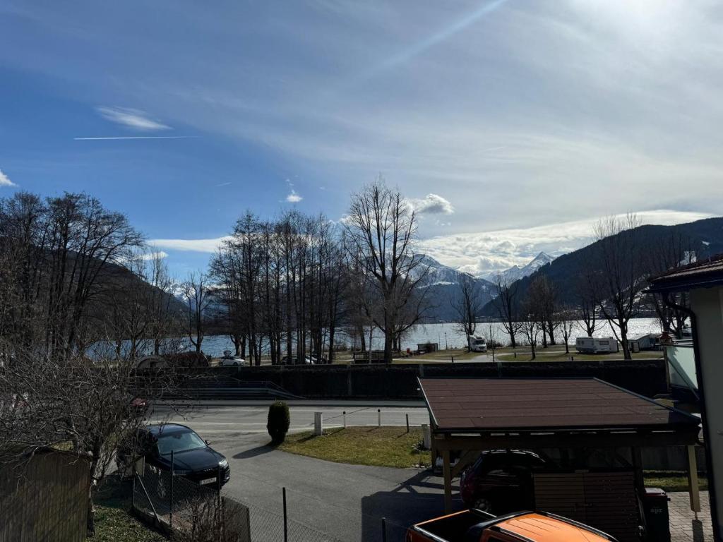 a parking lot with a view of a lake and mountains at Haus Imbachhorn Summer Card included in Zell am See