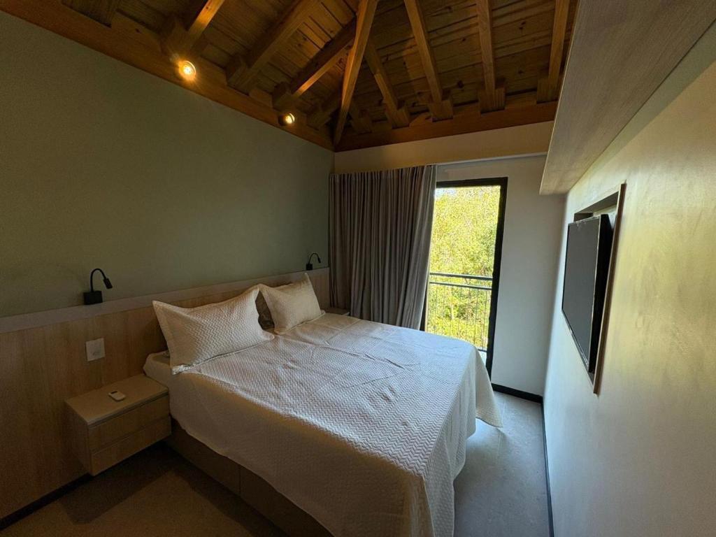 Giường trong phòng chung tại Casa em Praia do Forte