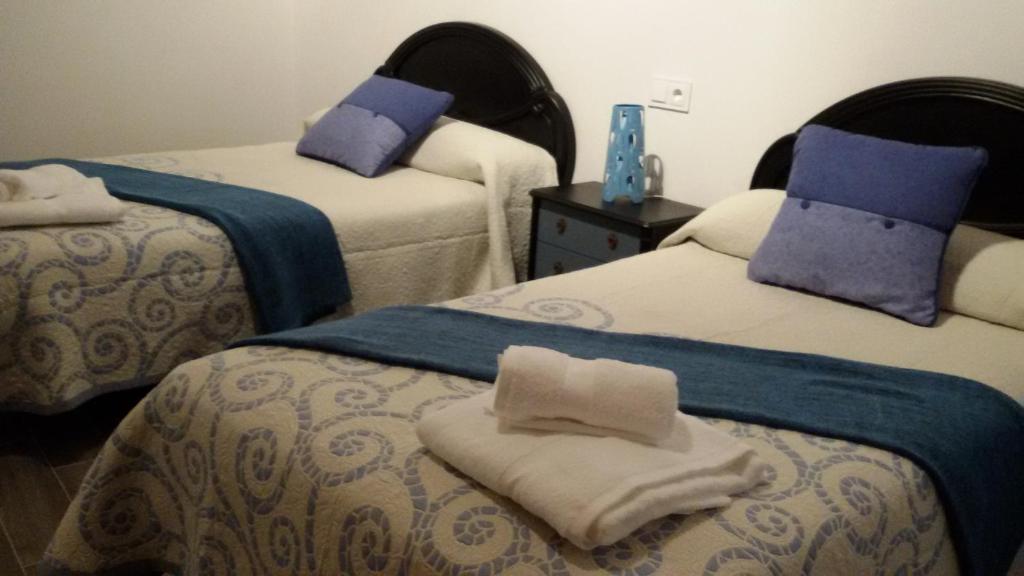 Postel nebo postele na pokoji v ubytování El Pilar de Don Gregorio