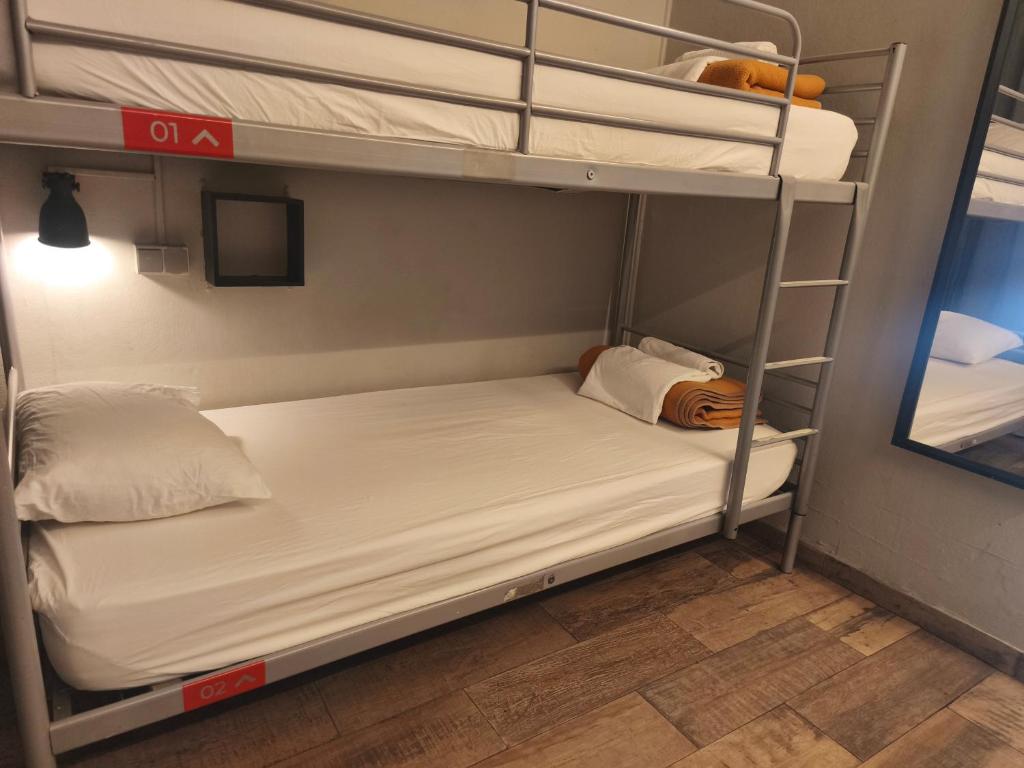 Una cama o camas en una habitación de Buba House