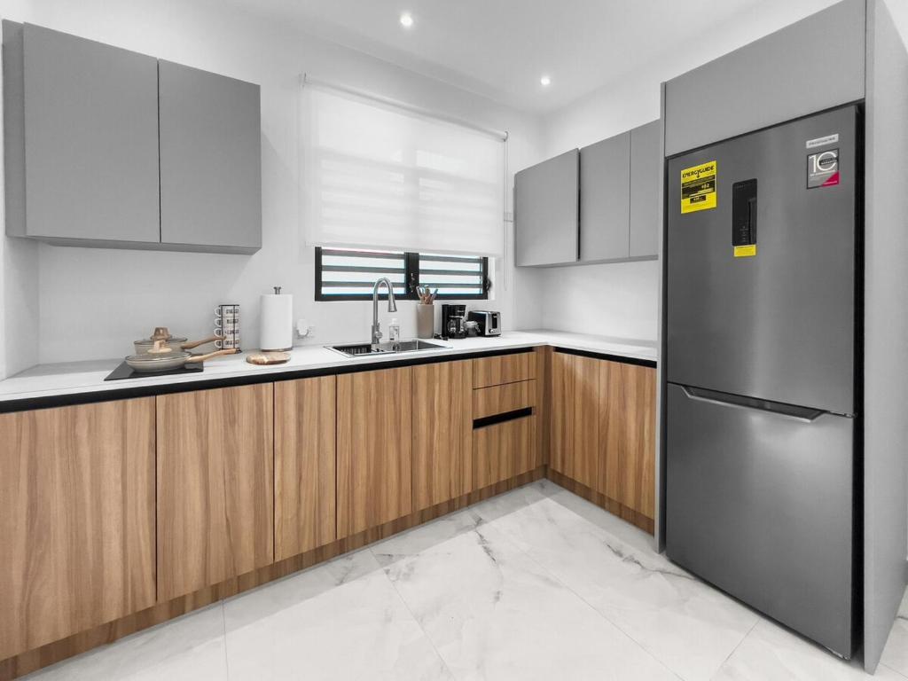 Η κουζίνα ή μικρή κουζίνα στο Hyde Park 4 Comfy Apt With Parking in San Juan