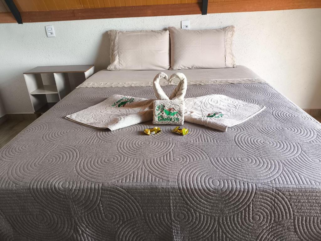 Ένα ή περισσότερα κρεβάτια σε δωμάτιο στο Chalés JH