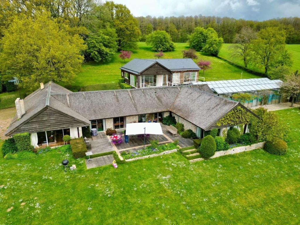 an aerial view of a large house with a garden at Maison Percheronne by Green Folies, 15p & piscine in La Gaudaine