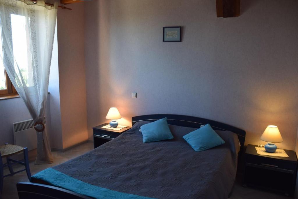 Ένα ή περισσότερα κρεβάτια σε δωμάτιο στο Le Grand Duc