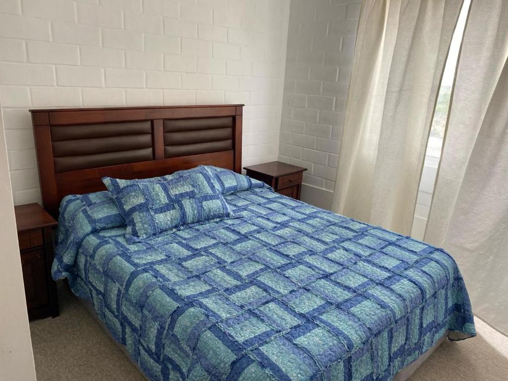 Ένα ή περισσότερα κρεβάτια σε δωμάτιο στο Casa completa amplia terraza y estacionamiento