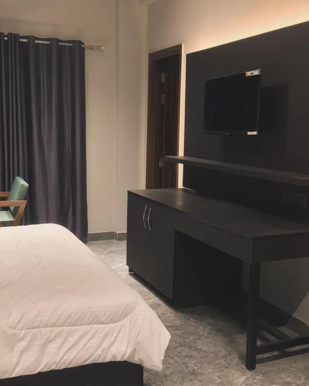 En eller flere senge i et værelse på Hotel Star Moon