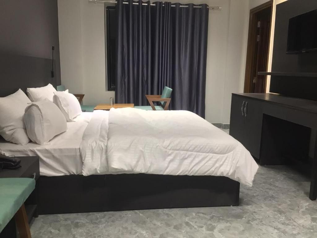 Ένα ή περισσότερα κρεβάτια σε δωμάτιο στο Hotel Star Moon