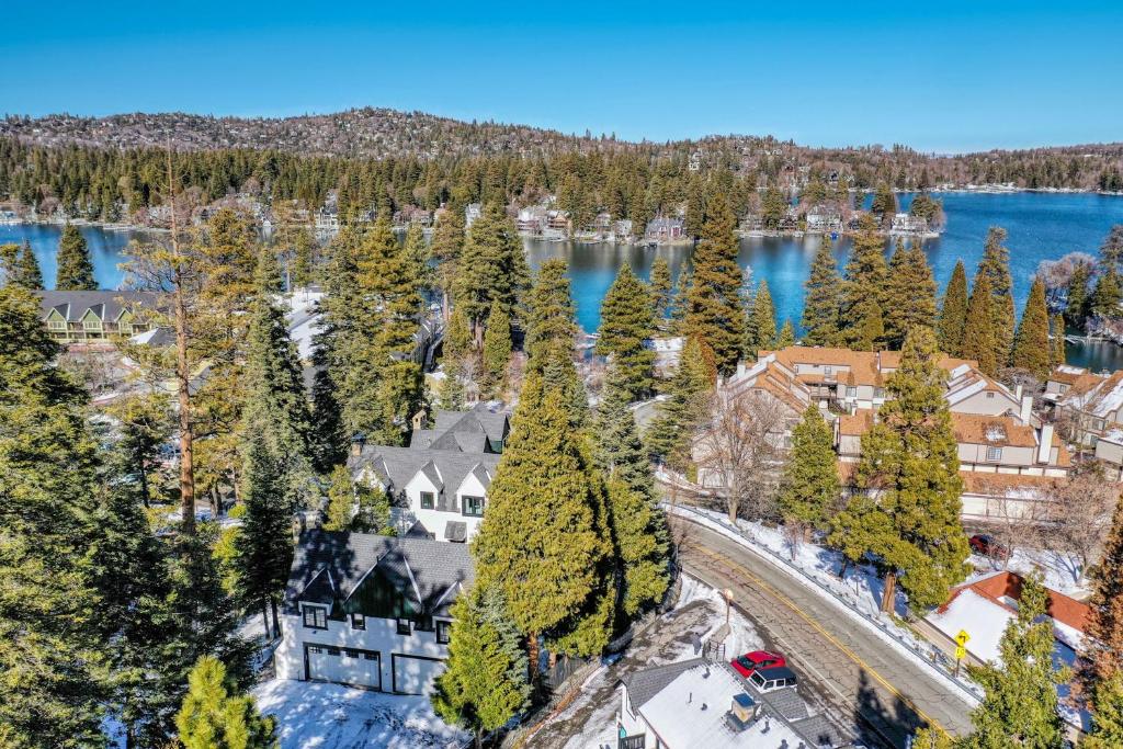 an aerial view of a house on the shore of a lake at Steps to Lake Arrowhead Village Chic Apartment in Lake Arrowhead