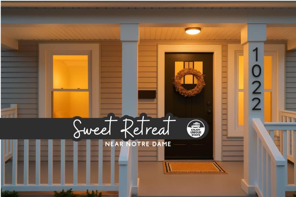 a house with a super referral sign on the front door at Sweet Retreat 3 Mins to Notre Dame Eddy St Commons and Memorial Hospital in South Bend