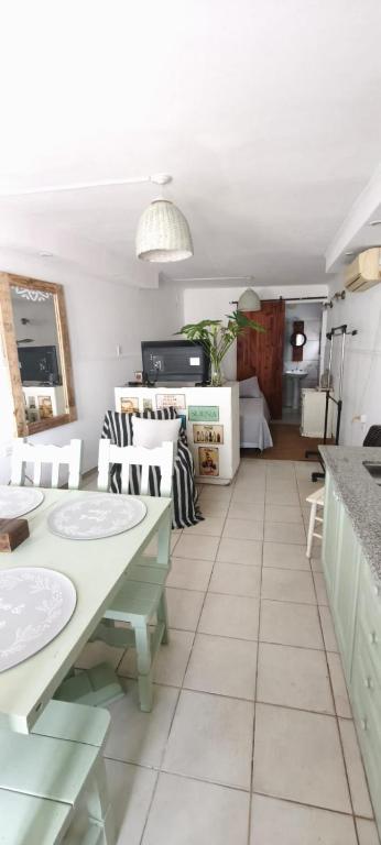 a living room with a table and chairs at Casa Rio in Cruz del Eje