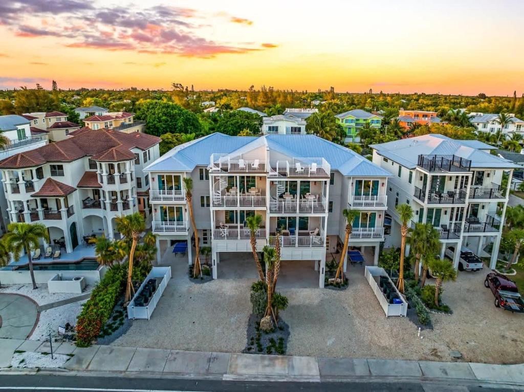 an aerial view of a large house with palm trees at Gulfside Green Estate in Siesta Key