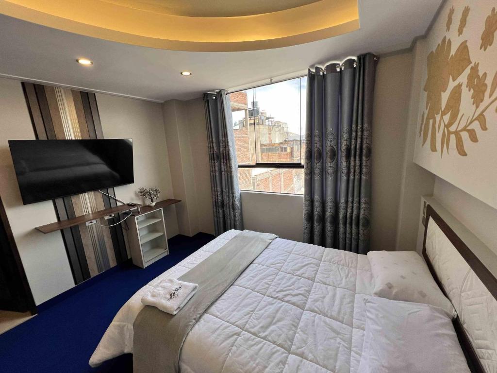 Ένα ή περισσότερα κρεβάτια σε δωμάτιο στο Wary Nayra Hotel & Spa