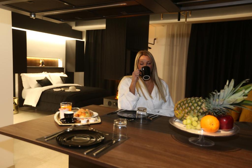 a woman taking a picture of a table with food at B&B Il Moro Luxury Rooms in Syracuse
