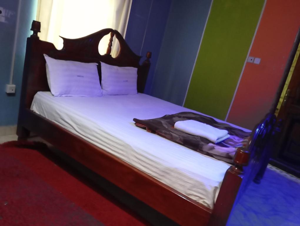 Ένα ή περισσότερα κρεβάτια σε δωμάτιο στο Villa Garbon Safaris Hotel