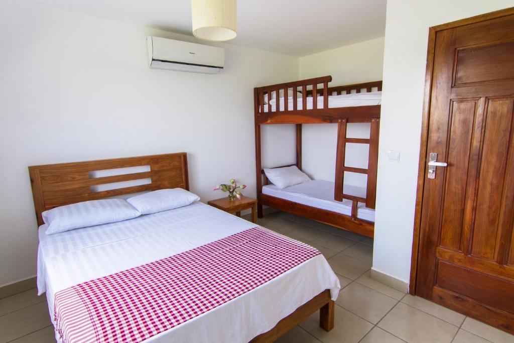 Ένα ή περισσότερα κρεβάτια σε δωμάτιο στο Le Kroma Villa