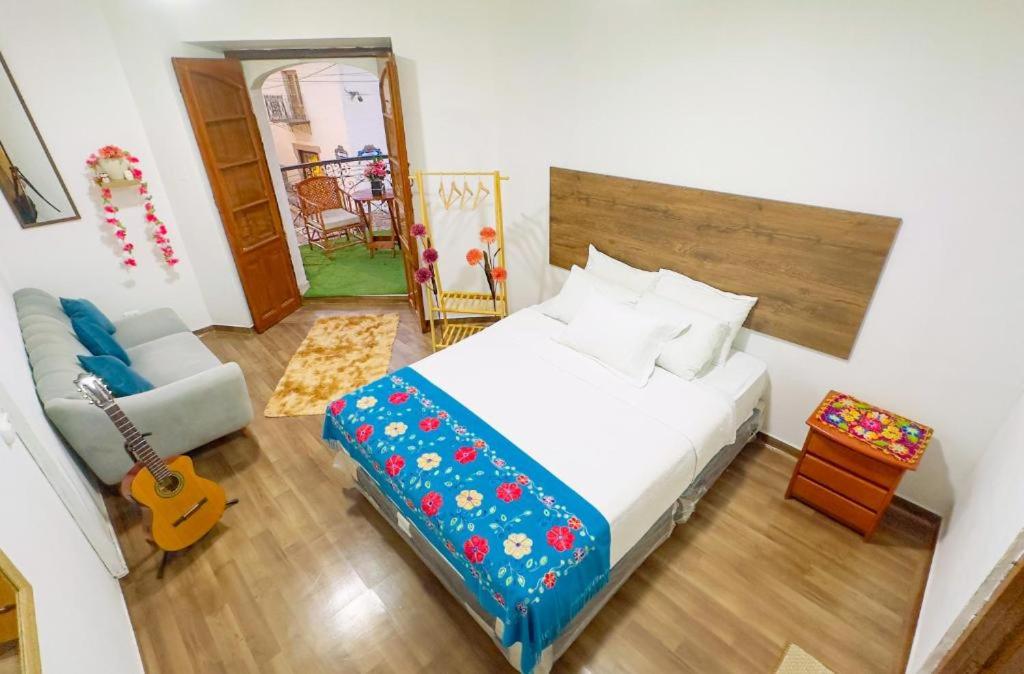 Postel nebo postele na pokoji v ubytování Casona MICA'S HOUSE