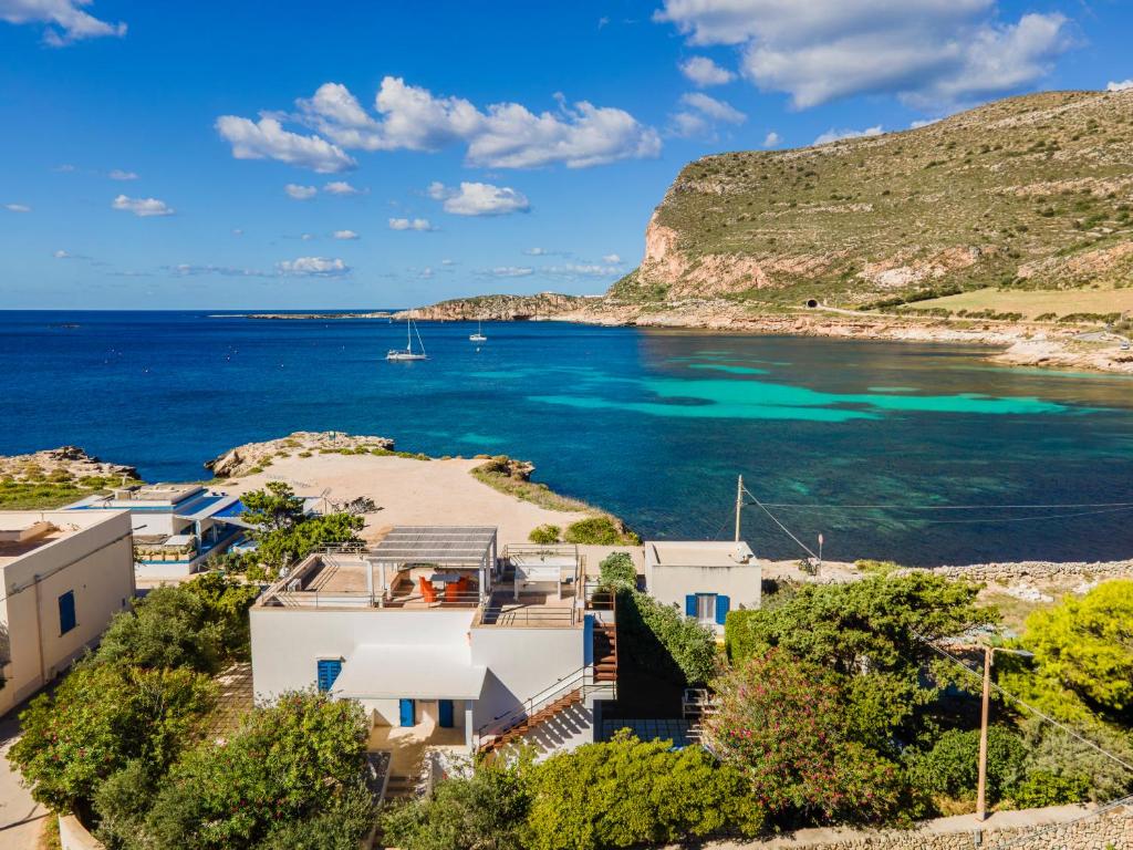 an aerial view of a house and the ocean at Villa Maresole in Favignana