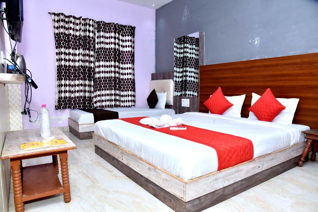 Giường trong phòng chung tại Hotel SD palace