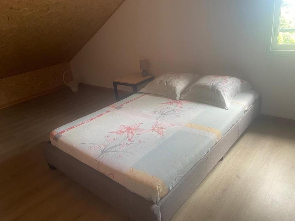 Postel nebo postele na pokoji v ubytování Le Strelitzia