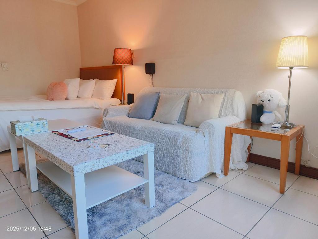 Postel nebo postele na pokoji v ubytování Niwill Homestay