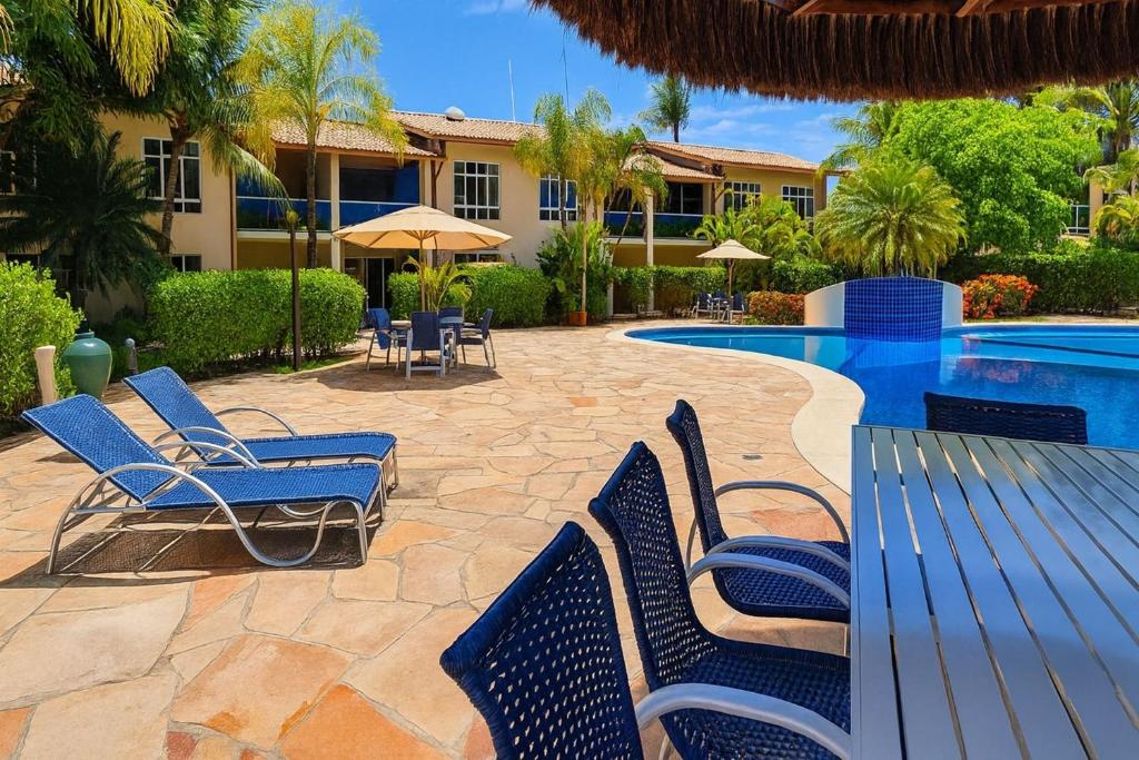 Πισίνα στο ή κοντά στο Duplex a 100 metros da Praia de Taperapuan