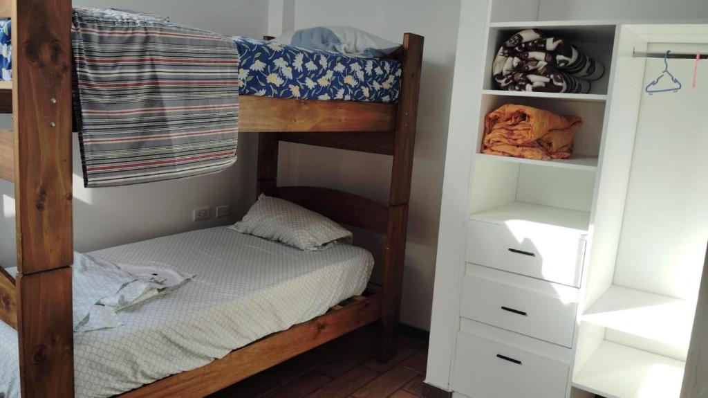 Ένα ή περισσότερα κρεβάτια σε δωμάτιο στο CASITA PARA FIN DE SEMANA