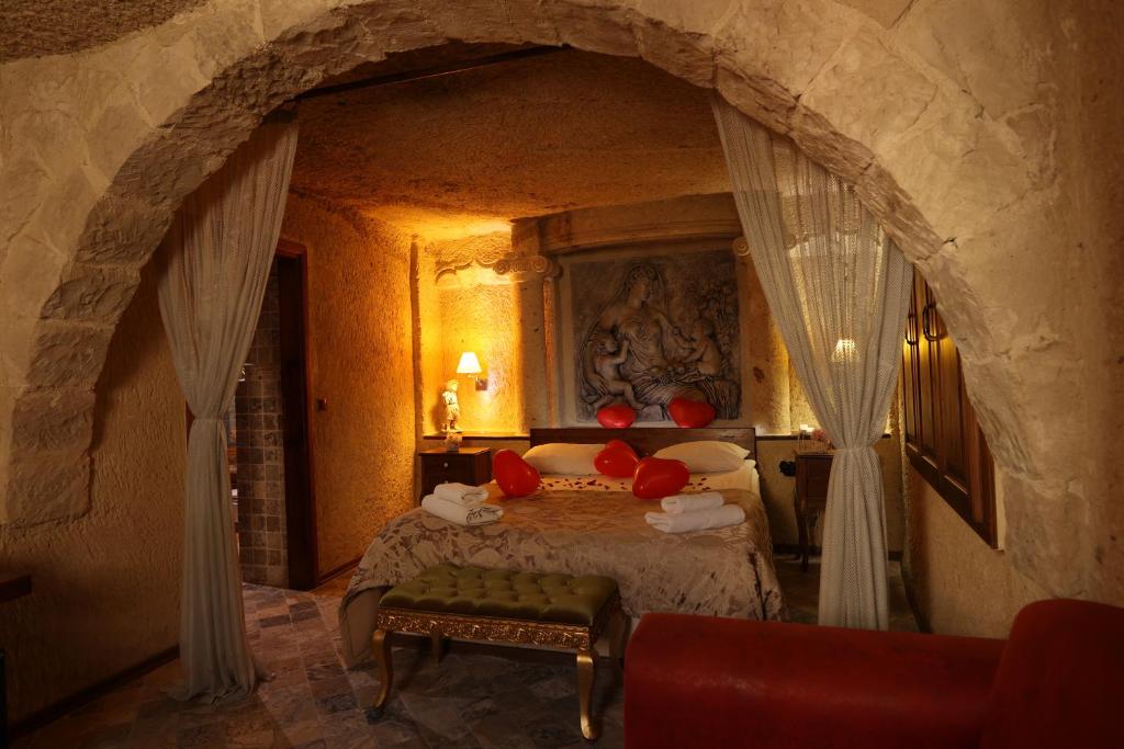 Postel nebo postele na pokoji v ubytování Artium Cave Hotel