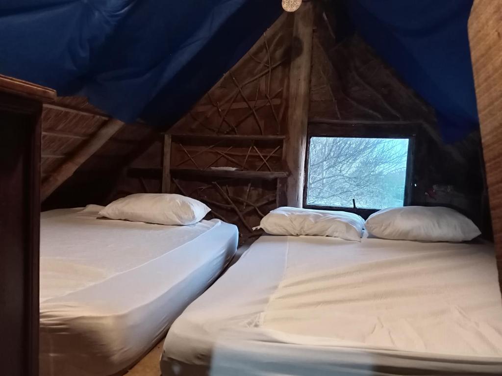 Ένα ή περισσότερα κρεβάτια σε δωμάτιο στο Cabaña en Barra de Valizas