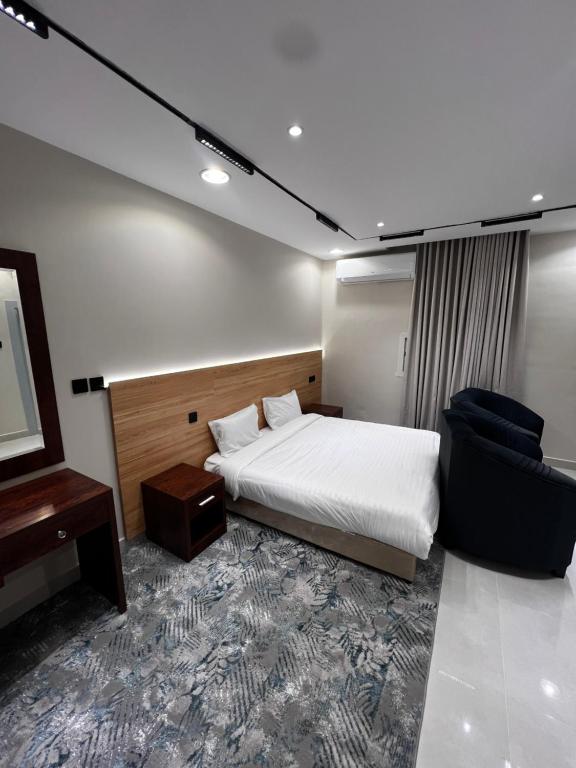 En eller flere senge i et værelse på Relax Home