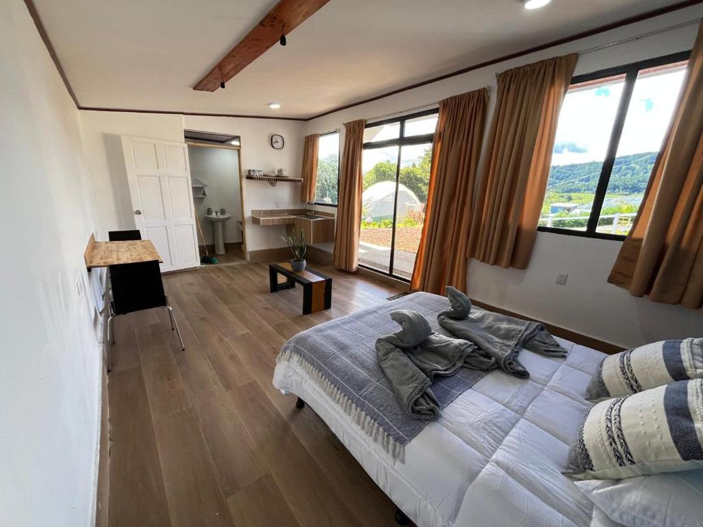 Ένα ή περισσότερα κρεβάτια σε δωμάτιο στο Green haven Poas