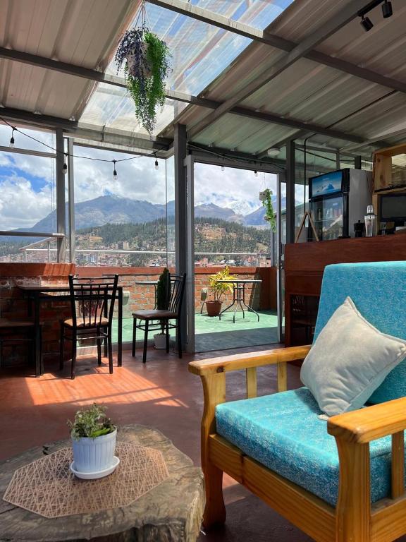 a living room with a couch and a table at Mariandes Hostel in Huaraz