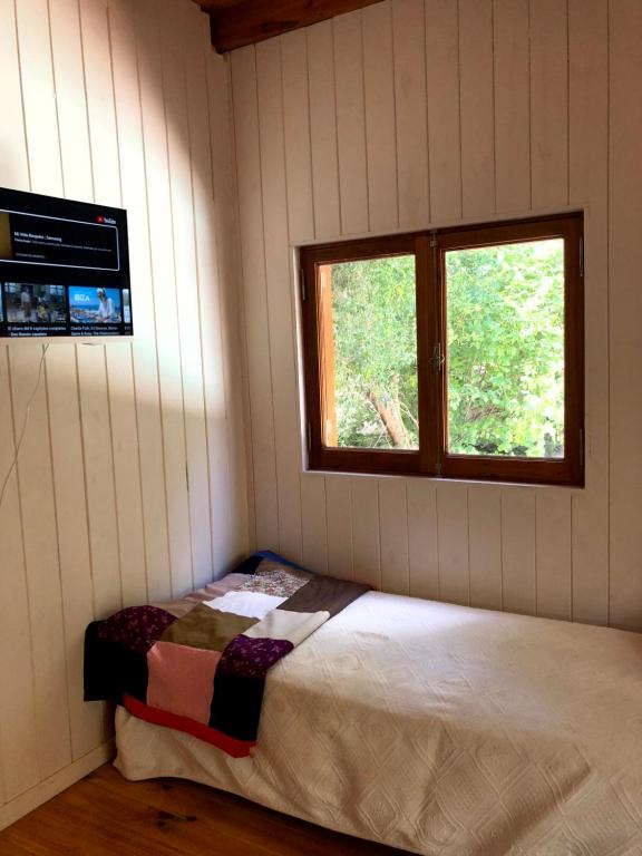 En eller flere senge i et værelse på Altos del Amanecer