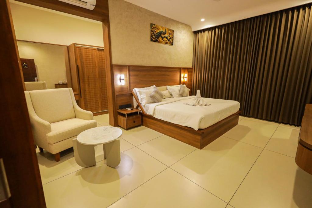 Ένα ή περισσότερα κρεβάτια σε δωμάτιο στο Townsquare Residency