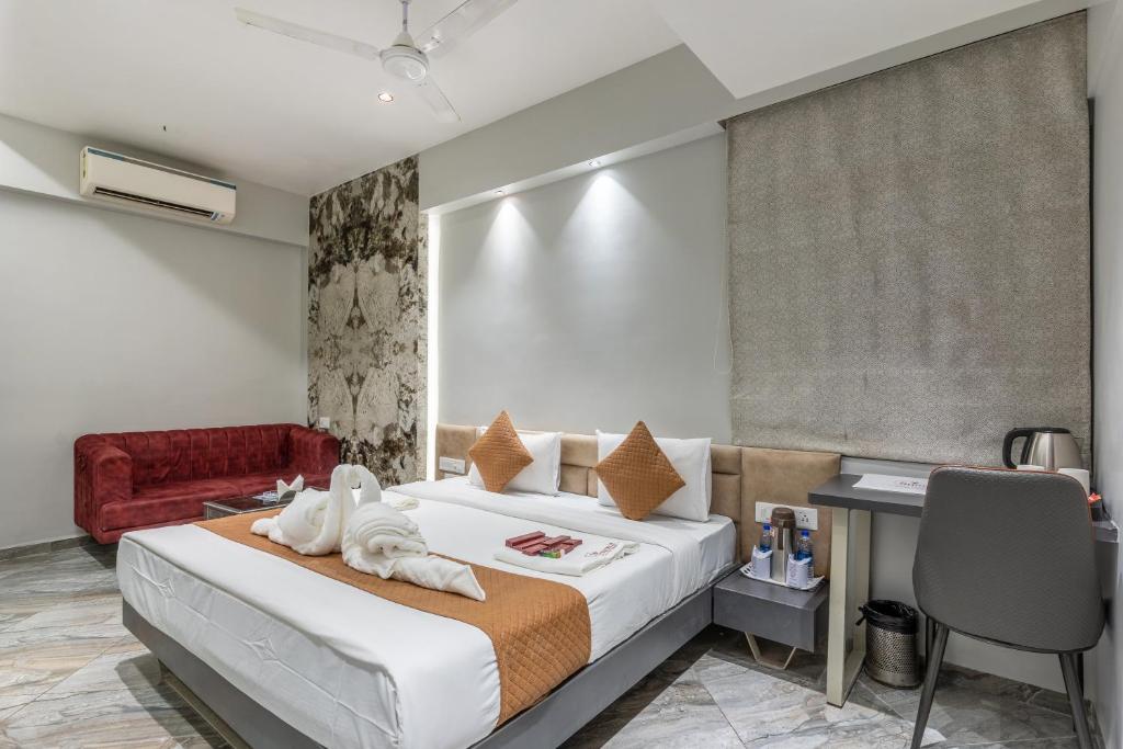 Una cama o camas en una habitación de Hotel Summit