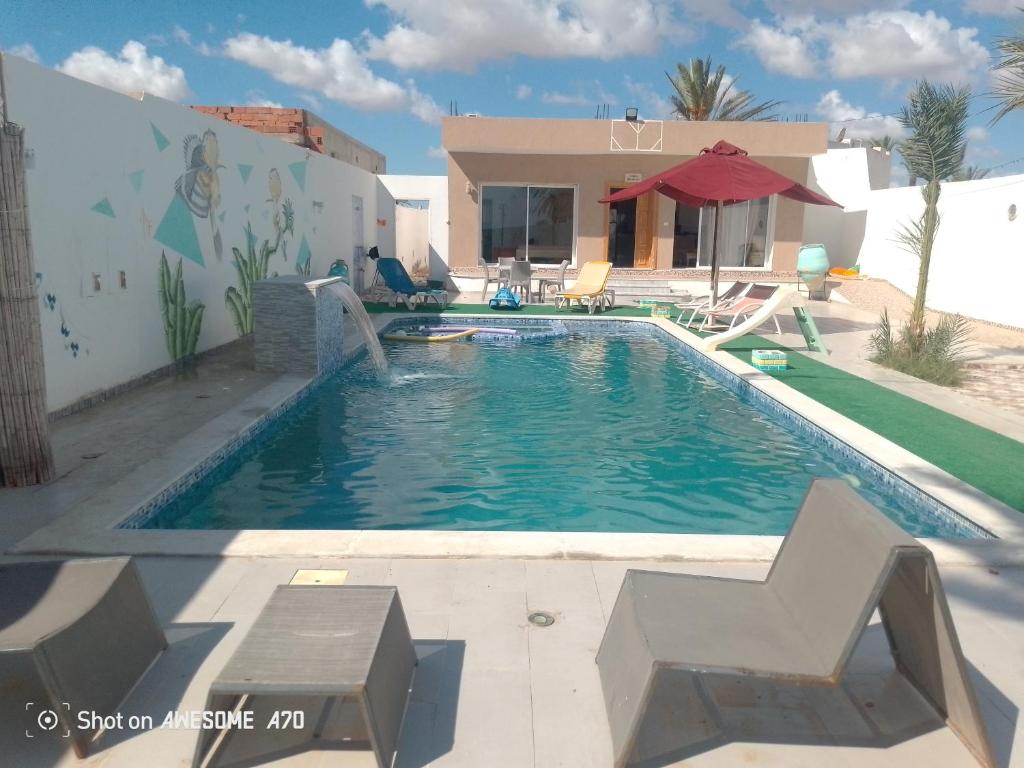 La alberca dentro o cerca de Villa Mahbouba face à la mer