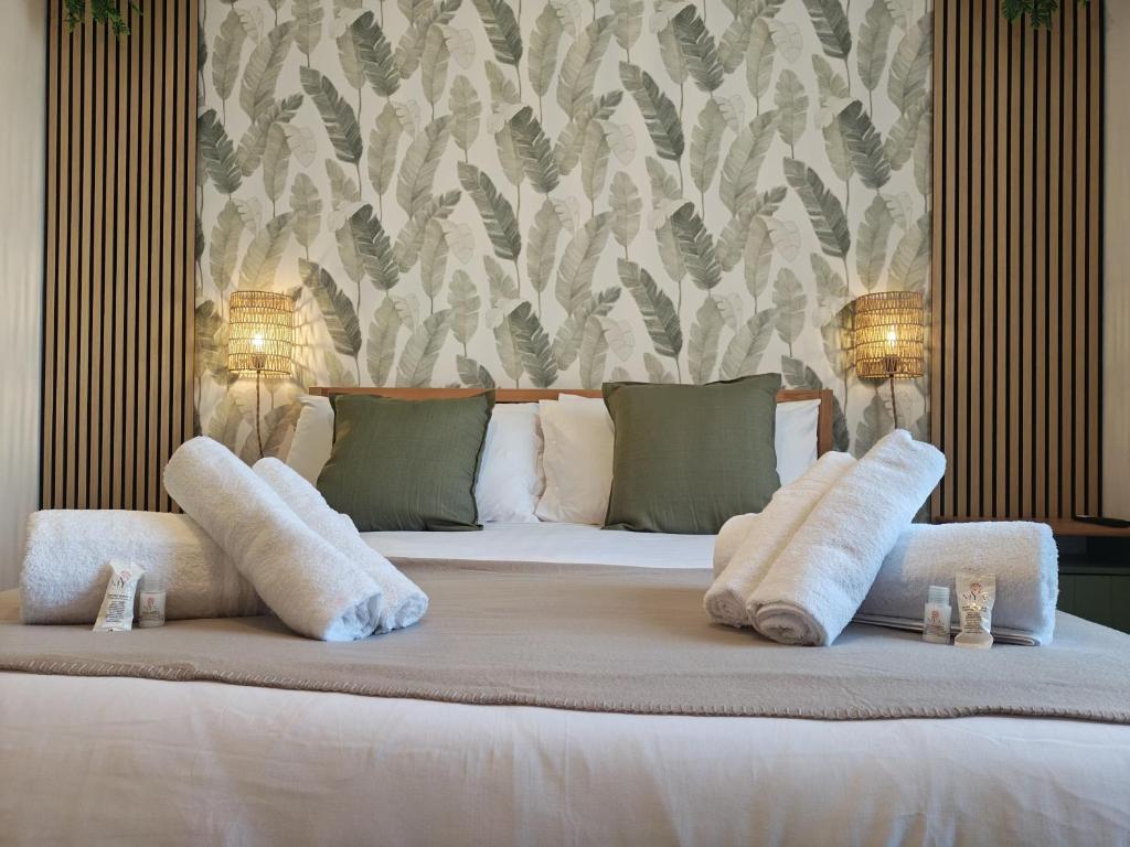 a bedroom with a bed with two pillows on it at Terrazza Groane in Garbagnate Milanese