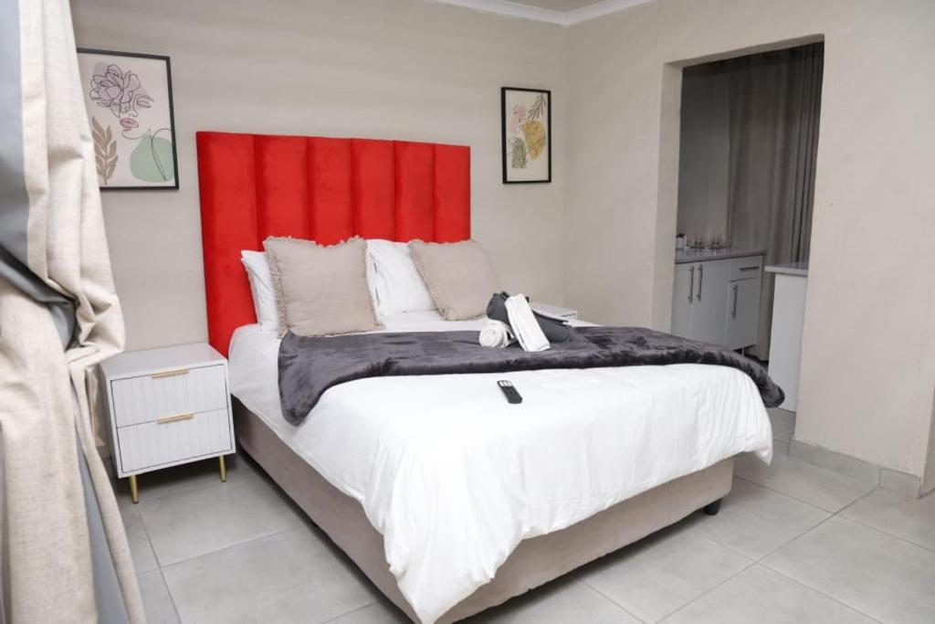 Ένα ή περισσότερα κρεβάτια σε δωμάτιο στο Lethabo Guesthouse