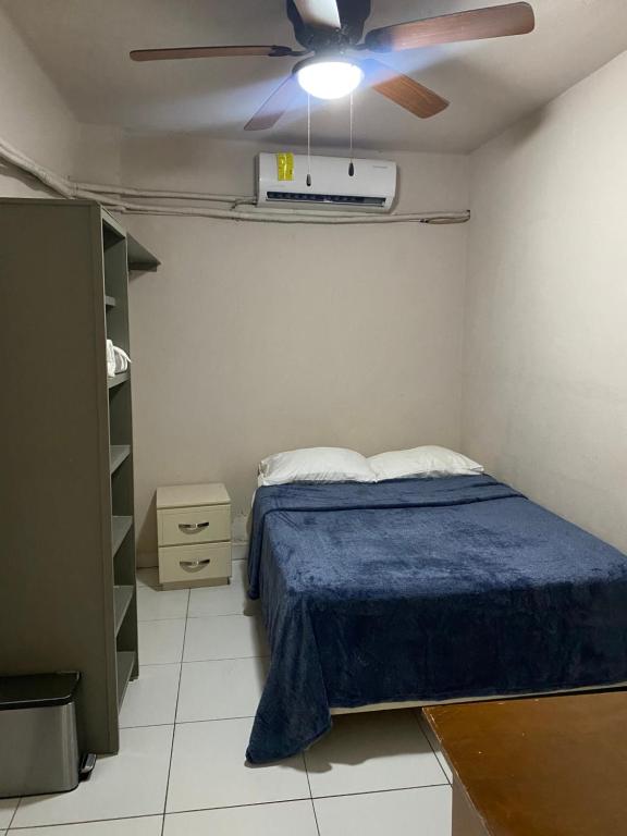 a bedroom with a bed and a ceiling fan at Habitacion C10 privada centro monterrey in Monterrey