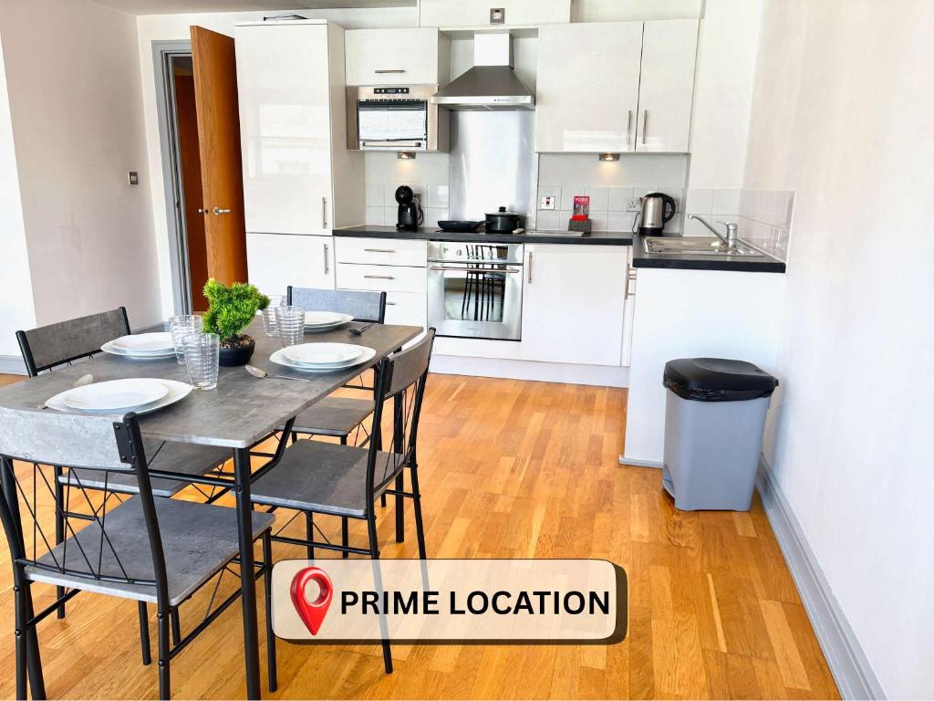 a kitchen and dining room with a table and chairs at York City Centre 2 Bed Flat with Views - Steps from Christmas Market in York