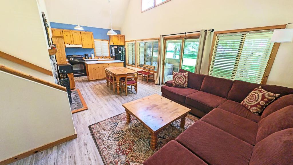 a living room with a couch and a table at Circle 4 Condo 14 in Sunriver