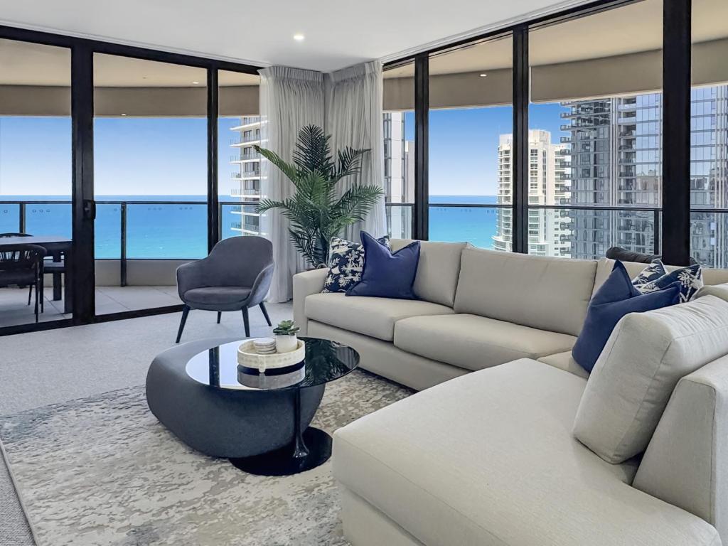 a living room with a couch and a table at Oceanview Luxury Escape Oracle Tower 2 Level 24 in Gold Coast